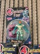Three Fantastic Four action figures in packages