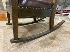 Turn-of-the-century oak rocking chair w/ upholstered seat and back panel