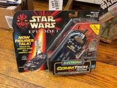Star Wars collectibles including: VHS tapes, figures, CommTech reader, Darth Vader watch