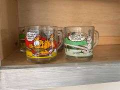 Four Garfield glass mugs