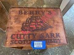 Two wooden advertising crates: Life Pears and Cutty Sark Whisky