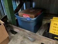 Items under workbench: plastic containers, mop wringer, grout and sand