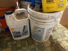 Yard blower in box, plastic kerosene can, antifreeze, motor oil, work gloves, misc