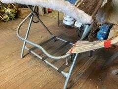 Fancy tooled leather saddle, saddle blanket,  and stand
