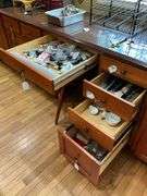 Contents of four drawers: gadgets, household items, measuring cups, power strip, misc