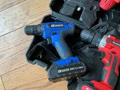 Cordless tool kit: two drills, mini chainsaw, charger