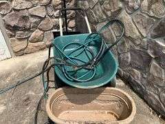 Wheelbarrow, garden hose, planter box, snow shovel
