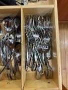 Contents of drawer: flatware, utensils