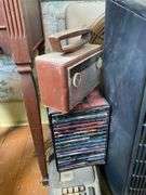 End stand, brass vanity mirror, metalware, vintage Zenith portable radio, GE plastic table radio, Cds, vintage adding machines, electric fans25.5x17.5x31