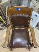 Turn-of-the-century oak rocking chair w/ upholstered seat and back panel