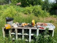 Wooden nesting box and contents: jump started, extension cords, coal bucket, buckets, replacement window, tools, misc