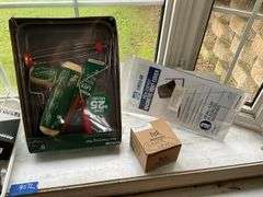 Floor lot and contents of windowsill: level, hand tools, painting supplies, laser level, misc