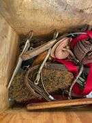 Horse tack in wooden crate