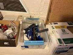 Ceramic tiles, wood bracket shelf, bungee cords, paint rollers, tape, misc