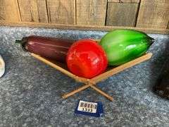 Blown art glass vegetables on wooden basket