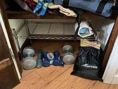 Contents of closet: hand weights, wire shelving, luggage, bags, misc