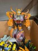 Toy lot including: Spider-Man car, WWE Sin Cara action figure, Transformers, misc