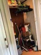 Contents of closet: MooSoo vacuum, Hoover upright vacuum, hand vac, cleaning supplies, Swiffer and refills, drawer unit, metal shelf unit, hangers, misc