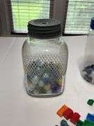 Jars of marbles, dice, and trinkets