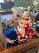 Collectibles lot: green art glass vase, glass Peanut pattern oil lamp, Christmas and other figurines, light strings, figural egg timer, misc