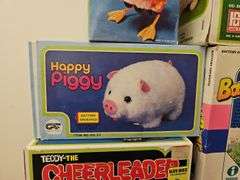 Wind-up and battery op toys in boxes including: Mother Goose, dog, pig, bears, calf