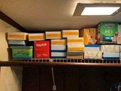 Contents of closet: MooSoo vacuum, Hoover upright vacuum, hand vac, cleaning supplies, Swiffer and refills, drawer unit, metal shelf unit, hangers, misc
