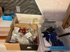 Ceramic tiles, wood bracket shelf, bungee cords, paint rollers, tape, misc