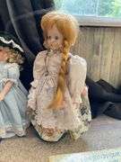Four porcelain collector dolls