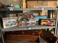 Contents of shelf: vintage car/truck model kits in boxes
