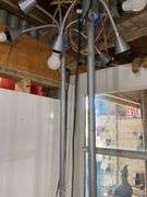 Two multi-lite adjustable arm floor lamps