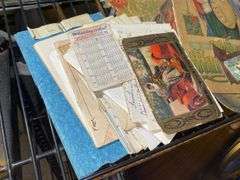 Paper ephemera including: postcards, child's Christmas book, 1960 advertising calendar