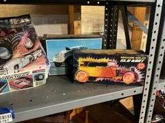 Contents of shelf: vintage car/truck model kits in boxes