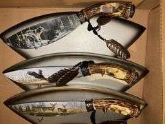 Three decorated wildlife knives/plaques