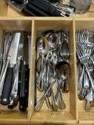 Contents of drawer: flatware, utensils