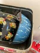 Three decorative lithographed tins, and blue & white swirl graniteware pan w/ bail handle