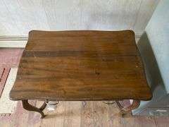 Turn-of-the-century library table w/ drawer in apron, sawn cabriole legs. Contents of drawer included  36x24x29