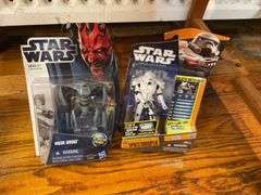 Star Wars collectibles including: VHS tapes, figures, CommTech reader, Darth Vader watch