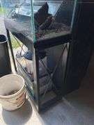 Aquarium on stand and two other aquariums, and accessories