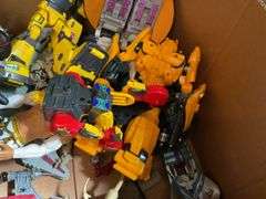 Toy lot including: Spider-Man car, WWE Sin Cara action figure, Transformers, misc