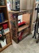 Wooden shelf unit covered w/ drawings - no contents 27.5x37x16.5