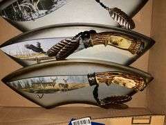 Three decorated wildlife knives/plaques