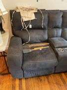 Gray double power recliner w/ central cup holders & USB jacks, 6 ft wide - no contents