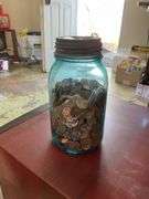 Blue canning jar of pennies