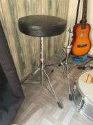 Snare drum, hi-hat cymbal, First Act guitar, two stools