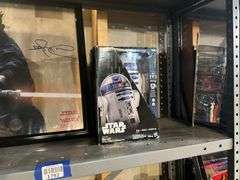 Contents of shelf: RC Star Wars R2D2 toy in box, Ray Park as Darth Maul framed print