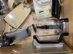 Contents of drawer: blenders, electric knife, hand mixer, grater
