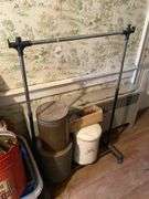 Garment rack, plasticware, tins, curtain rods, buckets, misc