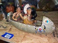 Native Americans in canoe figurine, two chalkware Native American heads - not all perfect