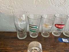 Seven advertising beer glasses