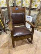 Turn-of-the-century oak rocking chair w/ upholstered seat and back panel